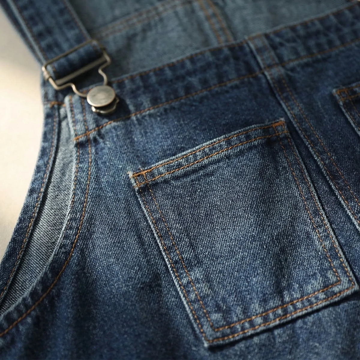 Relaxed fit denim dungarees with harem-style legs and patchwork panel details