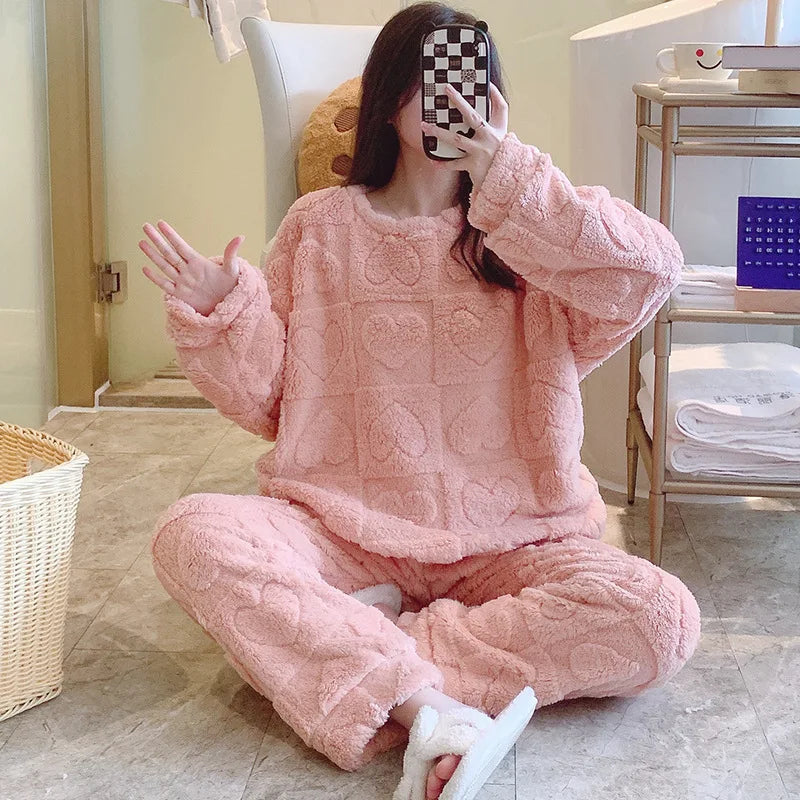 Warm lounge pyjama set with soft plush surface and heart texture