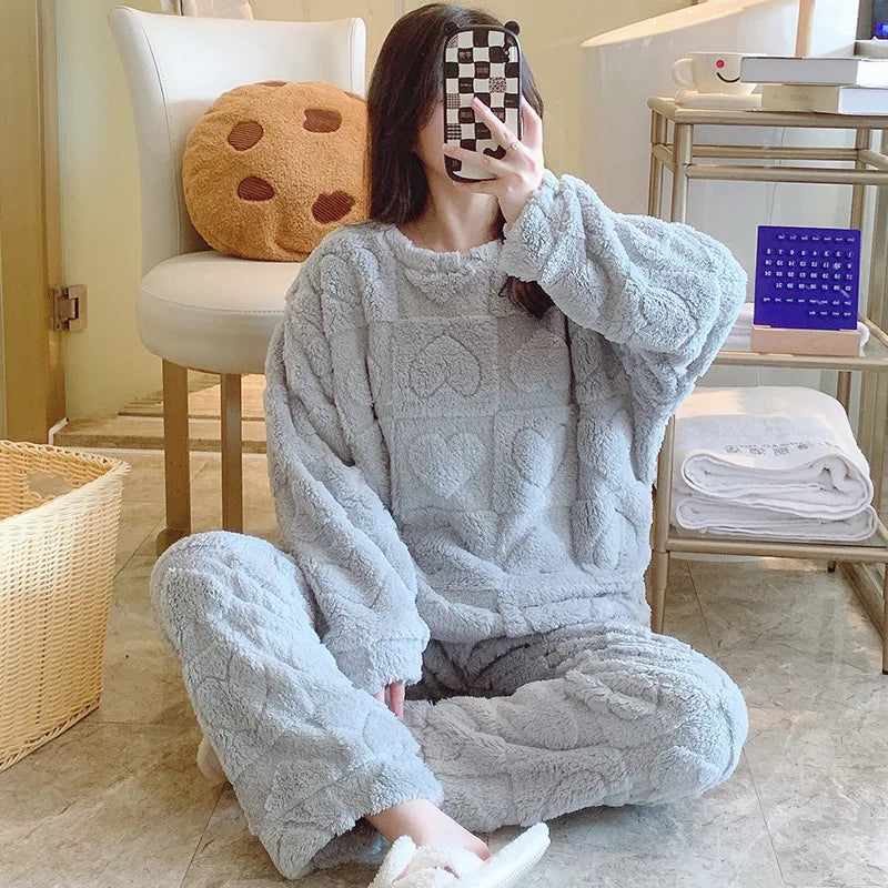 Warm lounge pyjama set with soft plush surface and heart texture