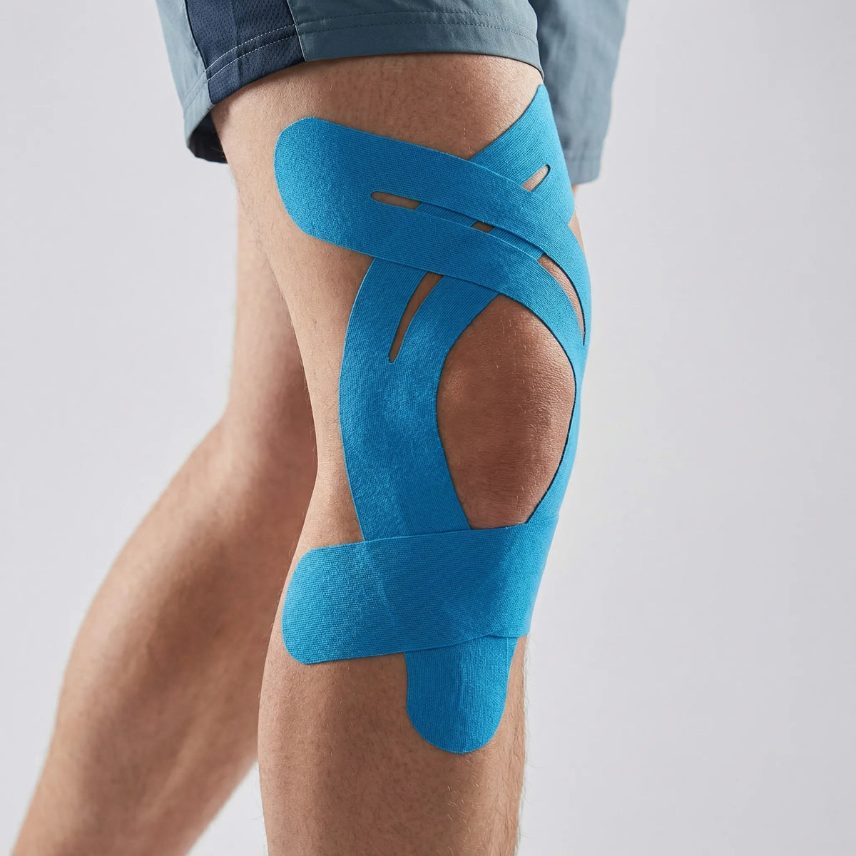 Elastic kinesiology knee tape with breathable open weave for running and training support
