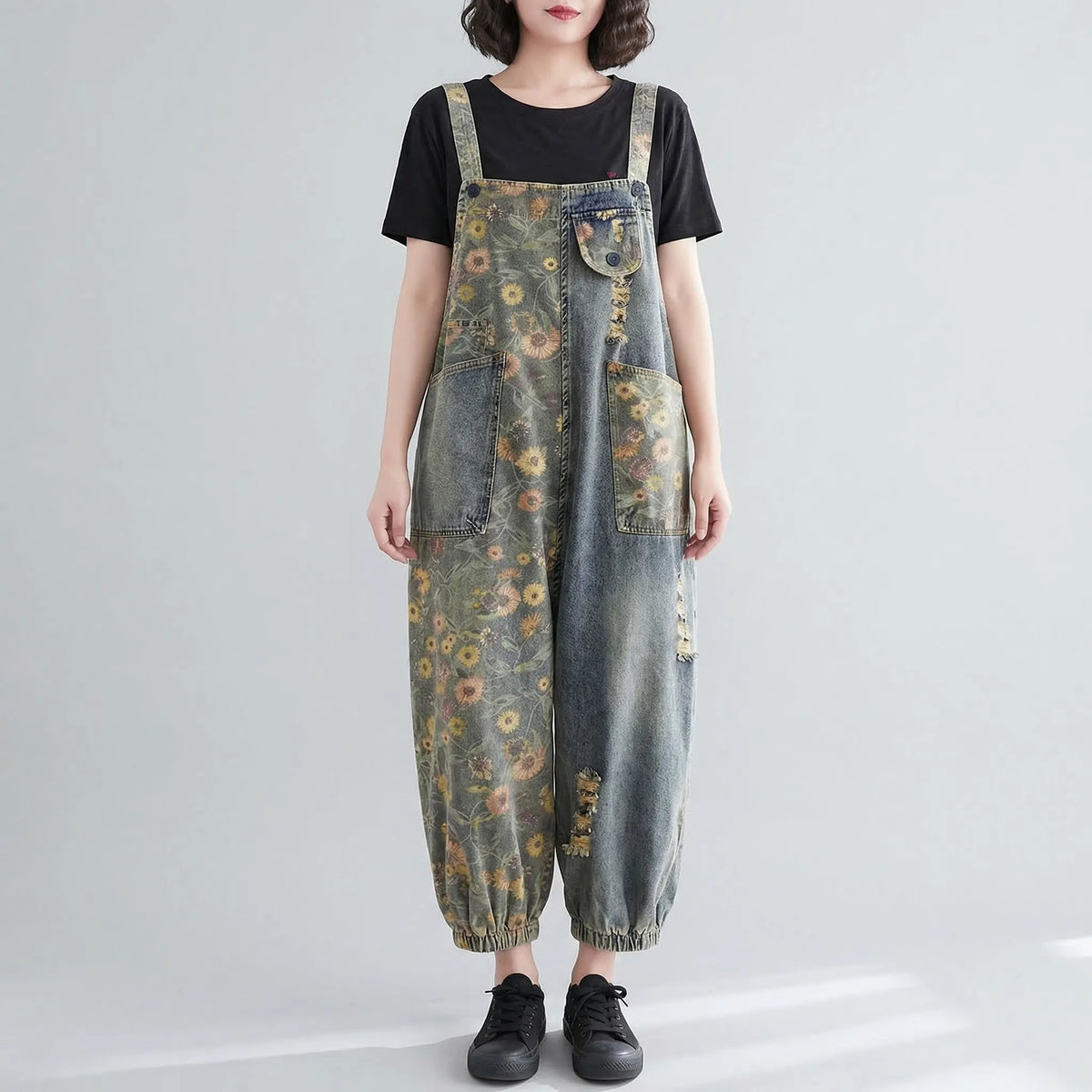 Denim dungaree with large-scale floral print and wide tapered leg