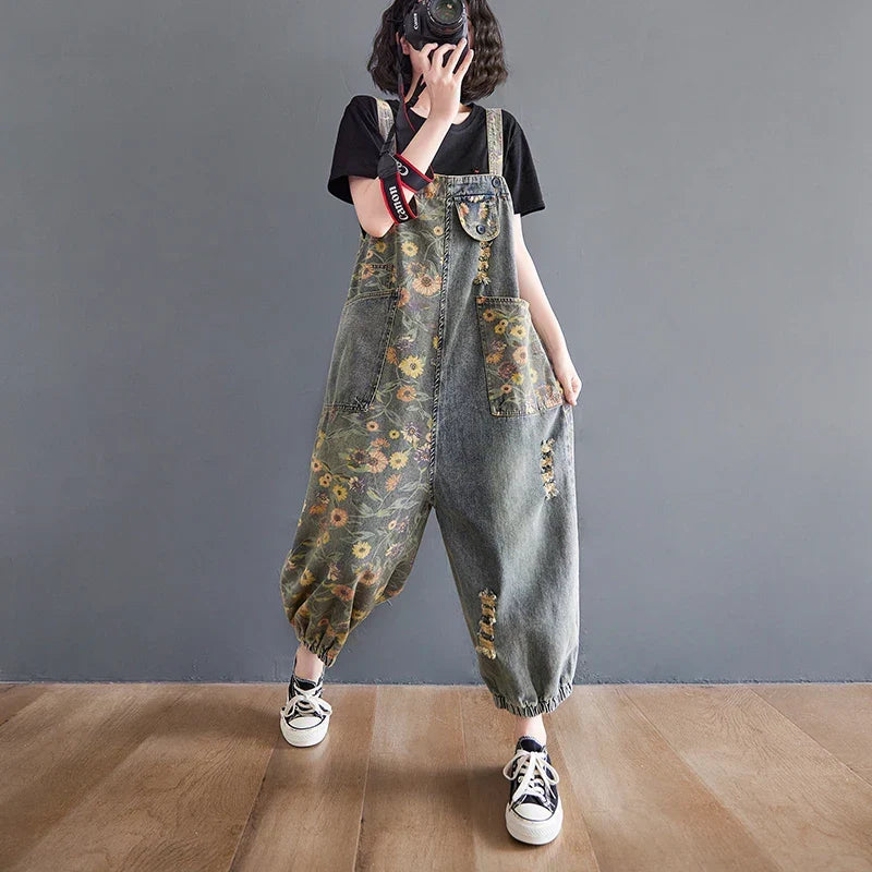 Denim dungaree with large-scale floral print and wide tapered leg