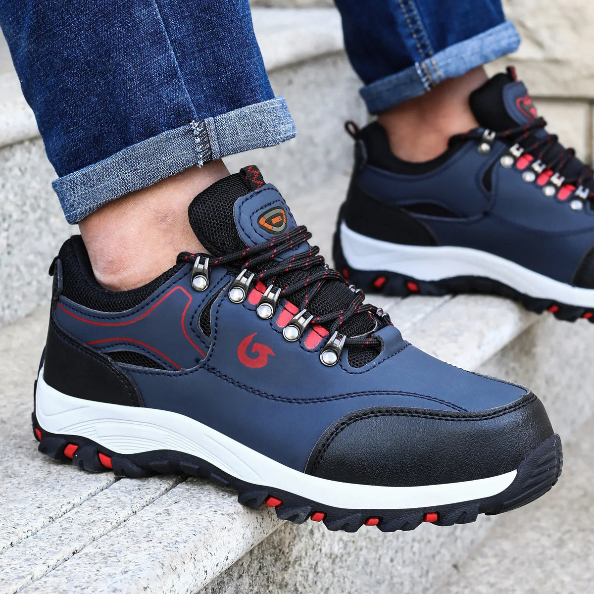Low profile safety sneakers with reinforced toe protection and high traction sole
