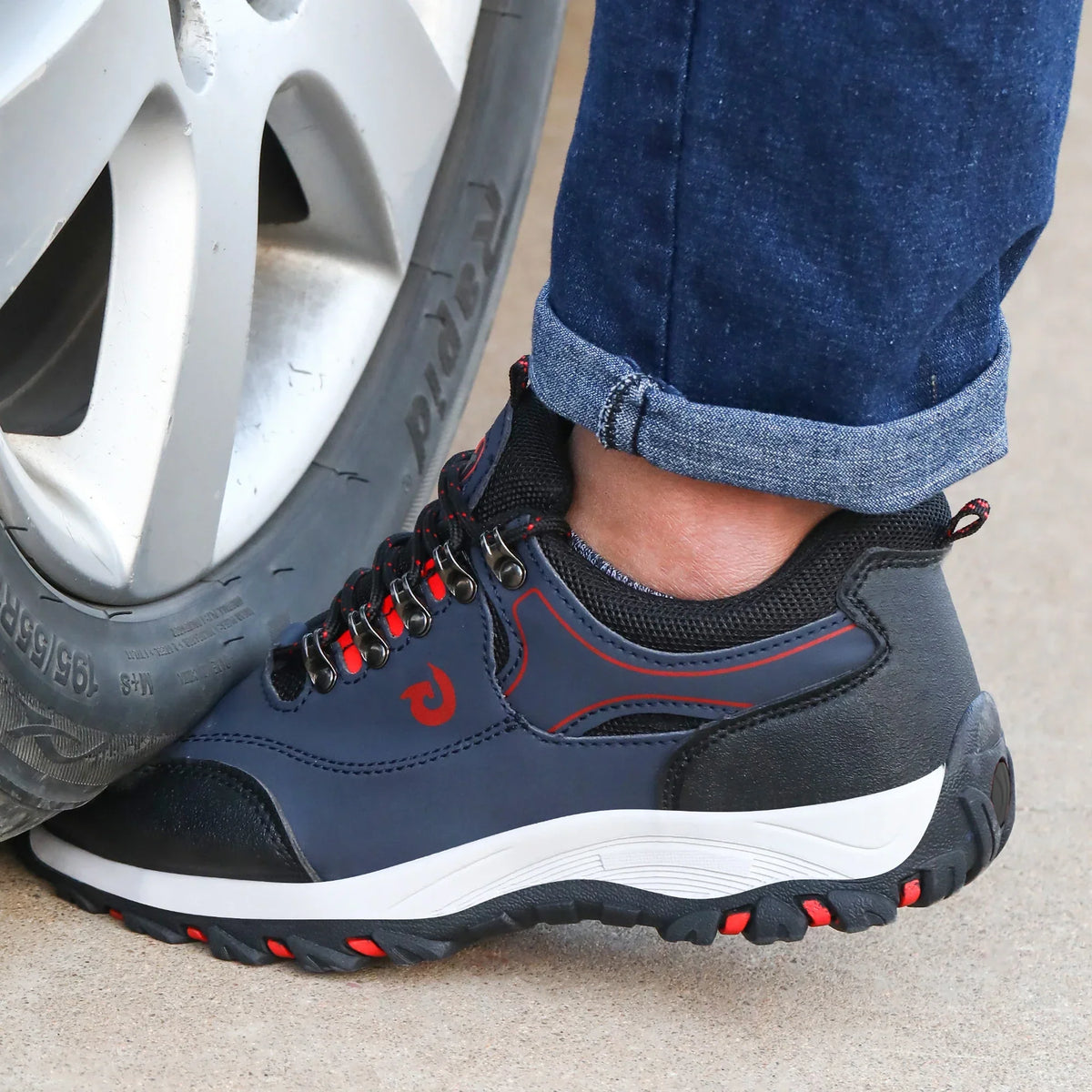 Low profile safety sneakers with reinforced toe protection and high traction sole