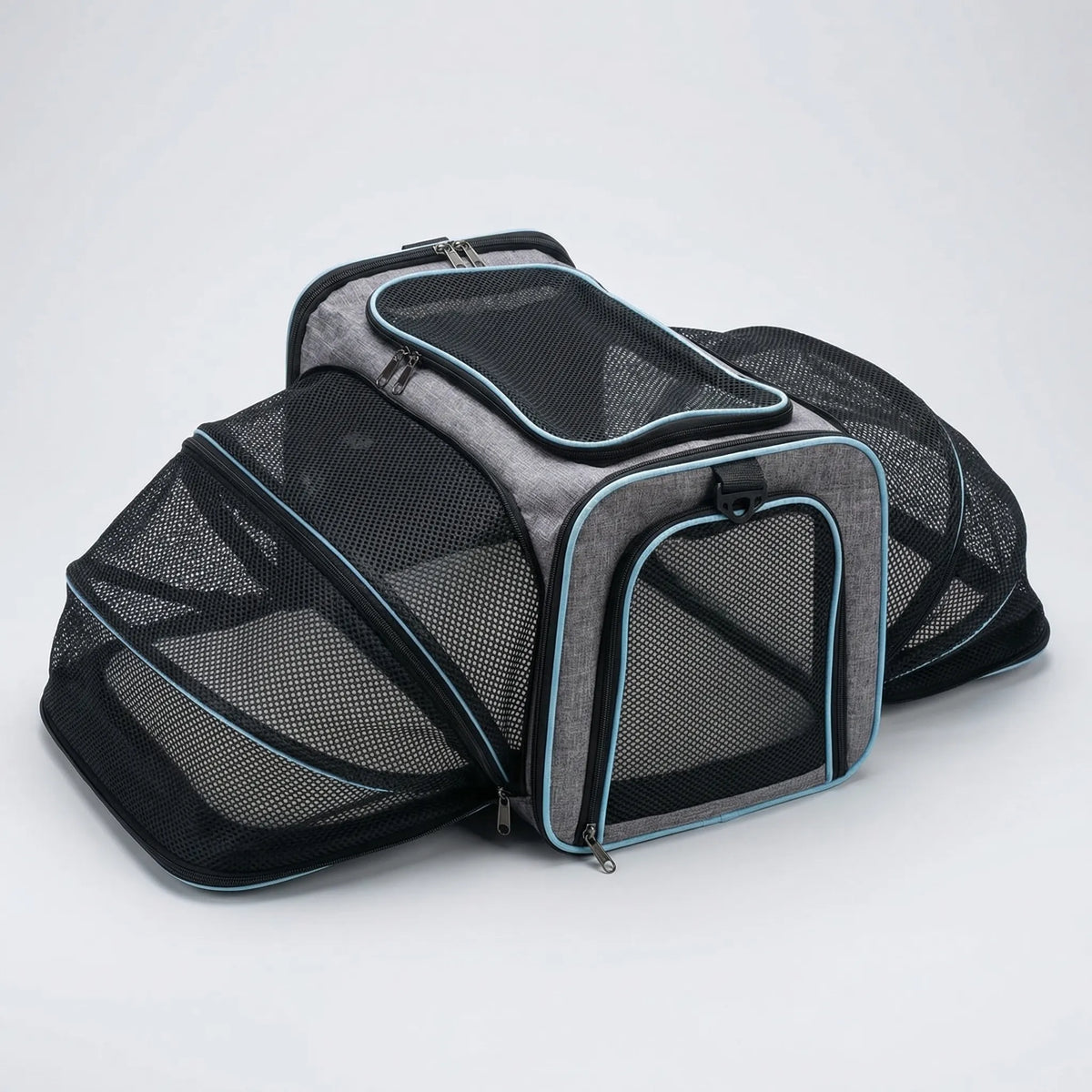 Expandable pet carrier with mesh panels and shoulder strap
