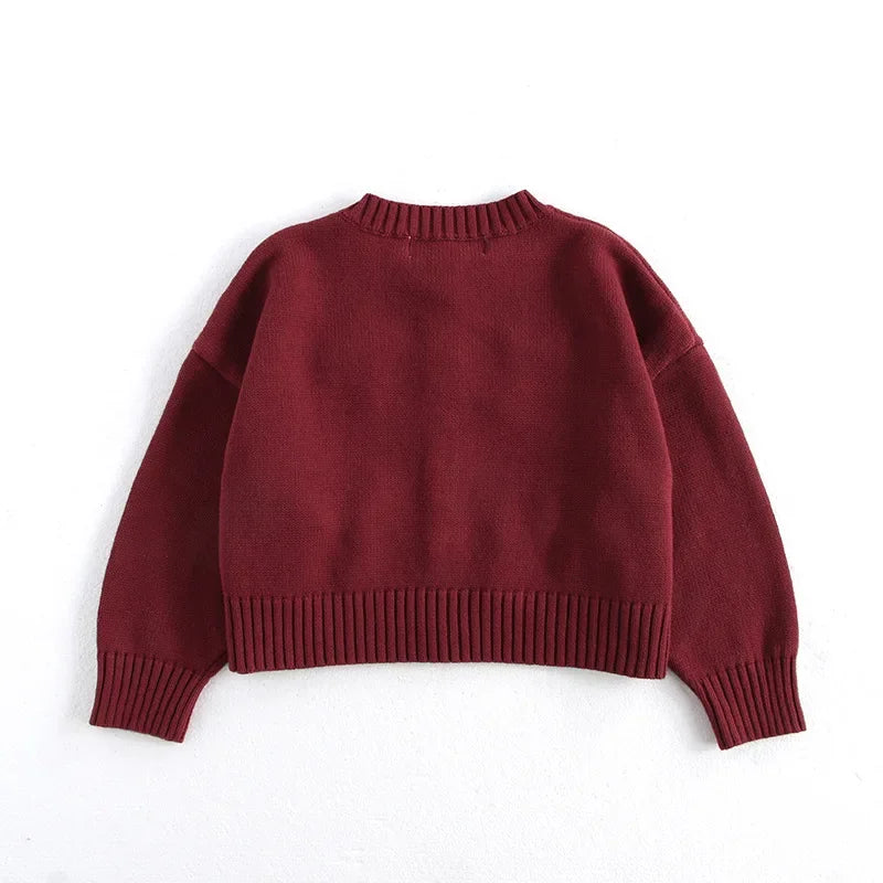 Girls knit cardigan with playful bows and ribbed details