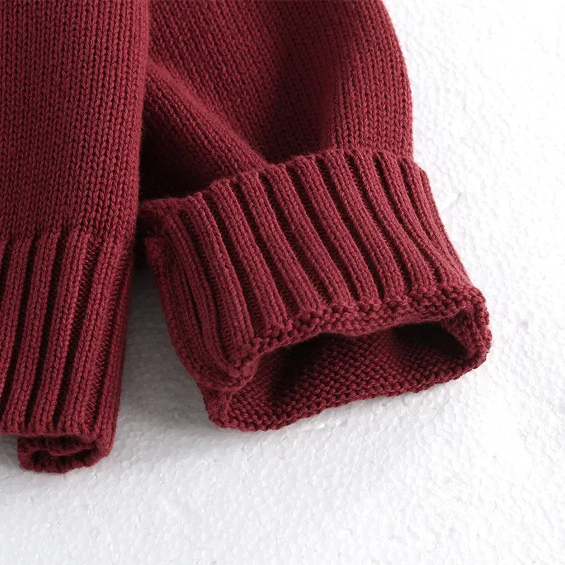 Girls knit cardigan with playful bows and ribbed details