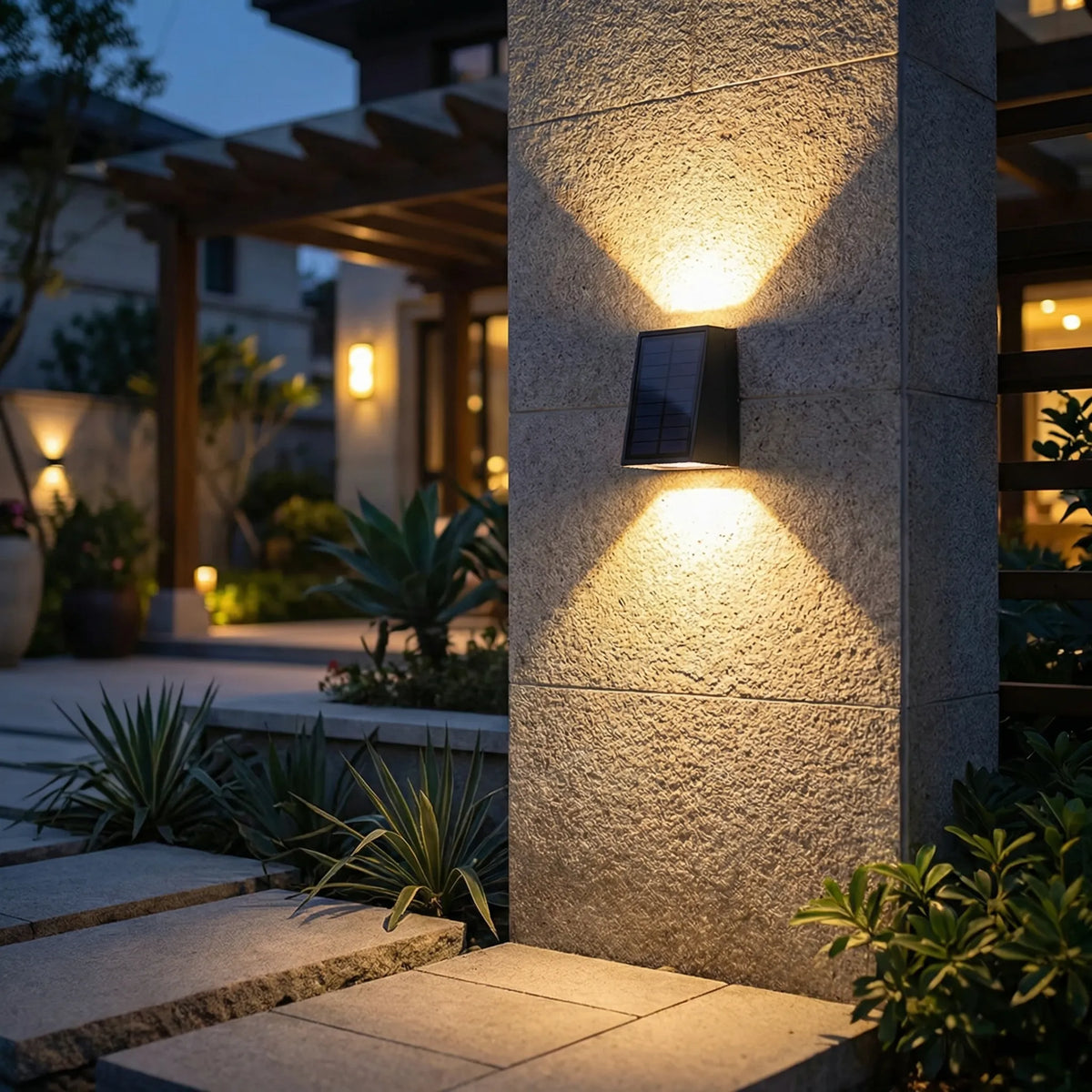 Solar-powered outdoor wall light with dual up-down beam pattern