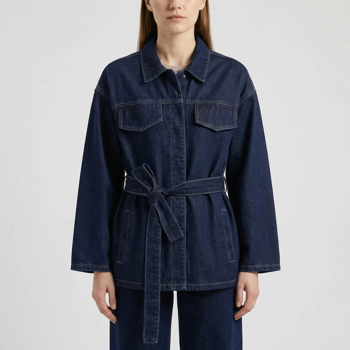 Women's denim co-ord set with belted jacket and wide-leg pants in indigo wash