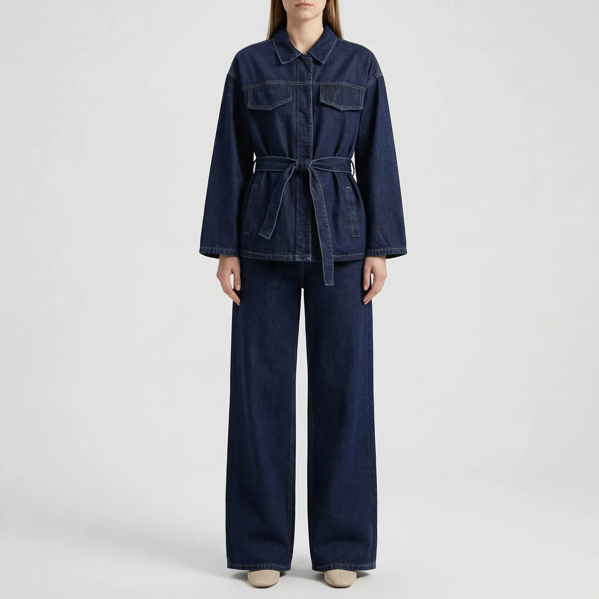 Women's denim co-ord set with belted jacket and wide-leg pants in indigo wash