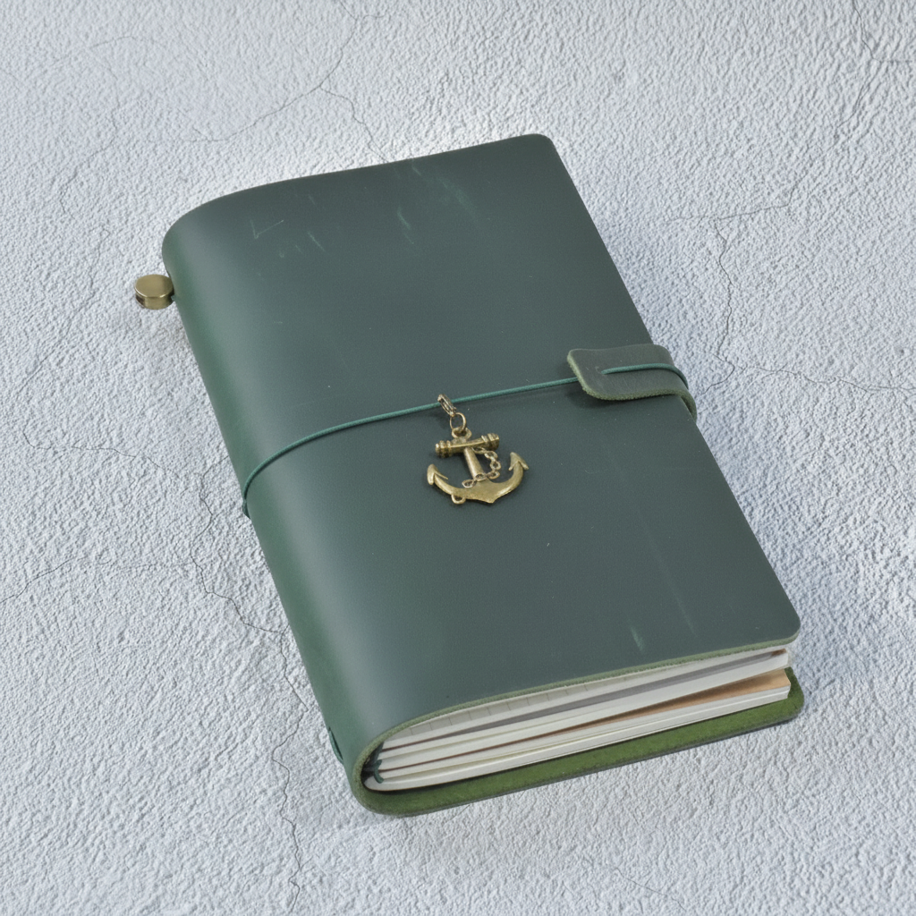 Refillable travel journal with retro handmade appearance and customisable charm accents