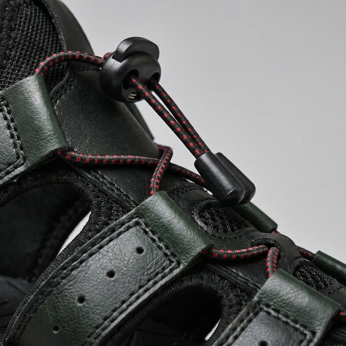 Men's closed-toe outdoor sandal with bungee lacing and ventilated sides