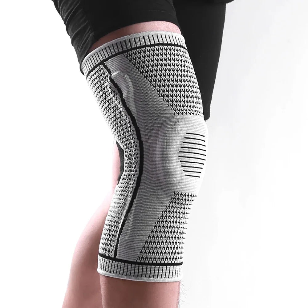 Breathable knee compression sleeve with silicone pad support