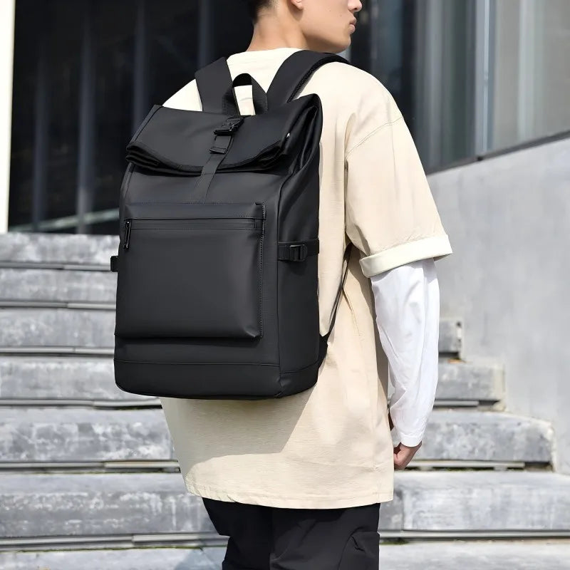 Large capacity commuter backpack with multiple compartments and adjustable padded straps
