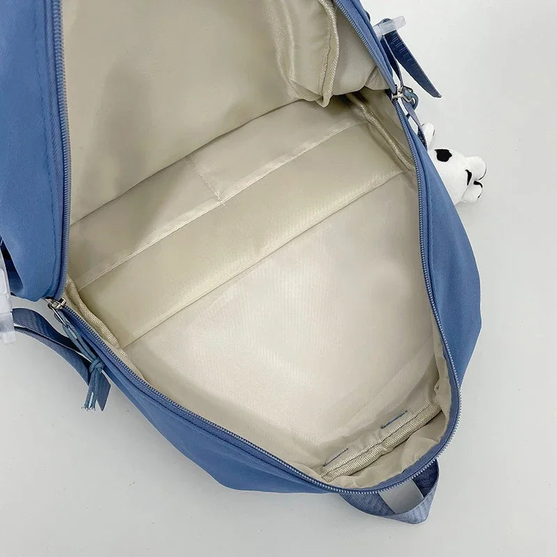 Student backpack with padded laptop compartment and ergonomic carrying system