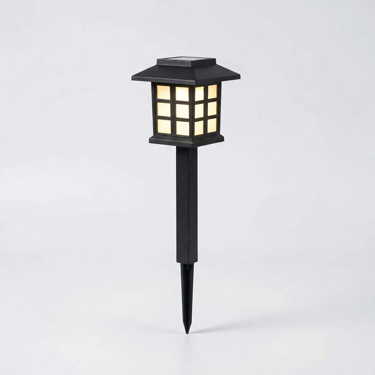 Solar pathway lantern with warm white light and automatic dusk sensor