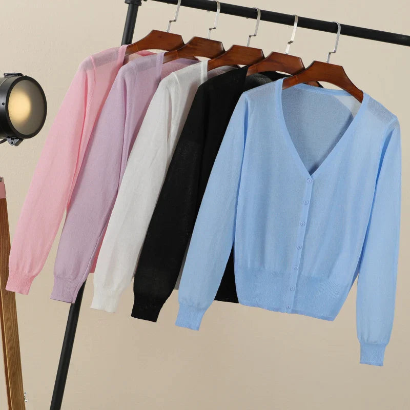 Women's cropped V neck cardigan with long sleeves and button front