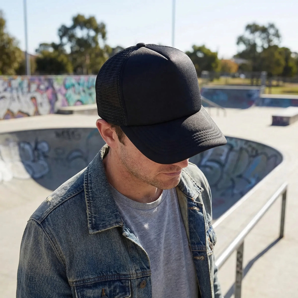 Plain mesh trucker cap with breathable back panel and snapback closure