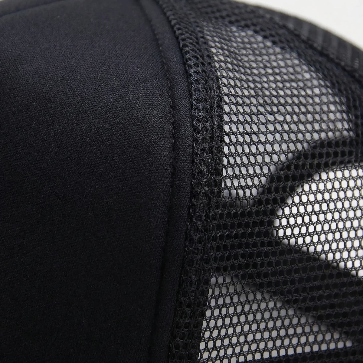 Plain mesh trucker cap with breathable back panel and snapback closure