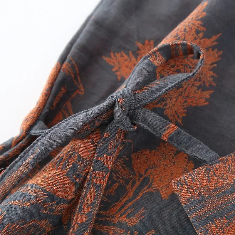 Lightweight kimono style robe with scenic printed design and breathable woven construction