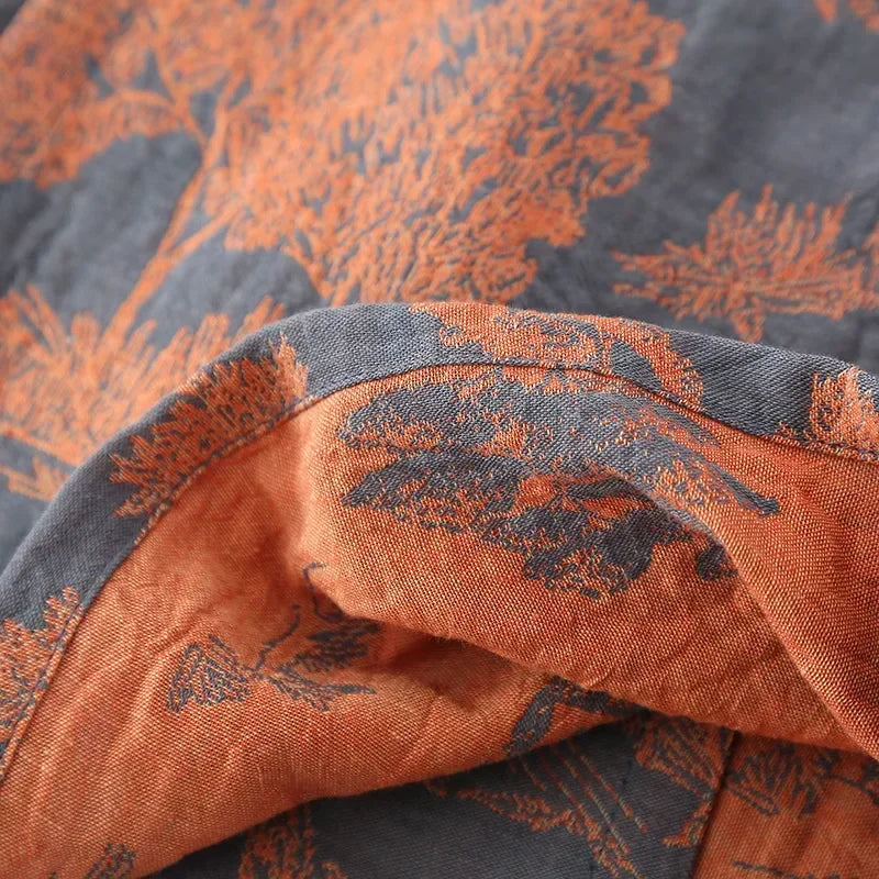 Lightweight kimono style robe with scenic printed design and breathable woven construction