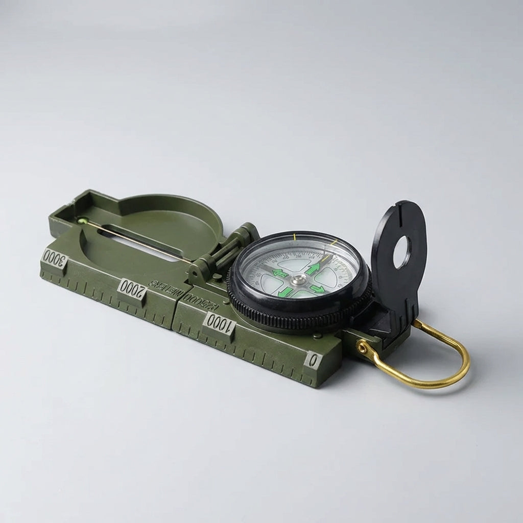 Compact folding sighting compass with water-resistant construction and integrated map scales
