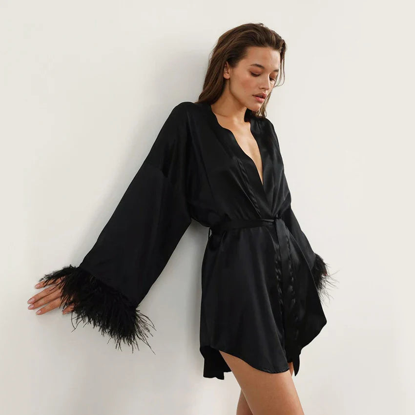 Short wrap robe with feather-trimmed sleeves and adjustable tie waist