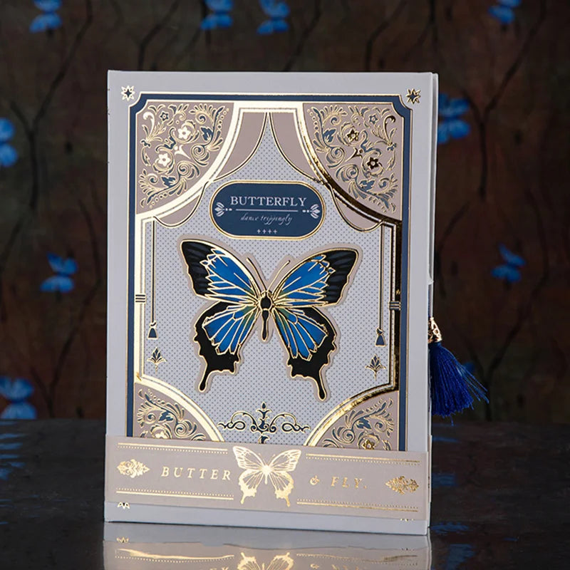 Hardcover illustrated notebook with butterfly design and metallic accents