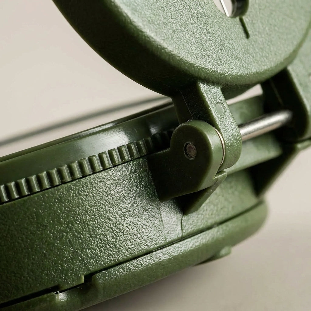 Lensatic field compass with phosphorescent markings for hiking and camping