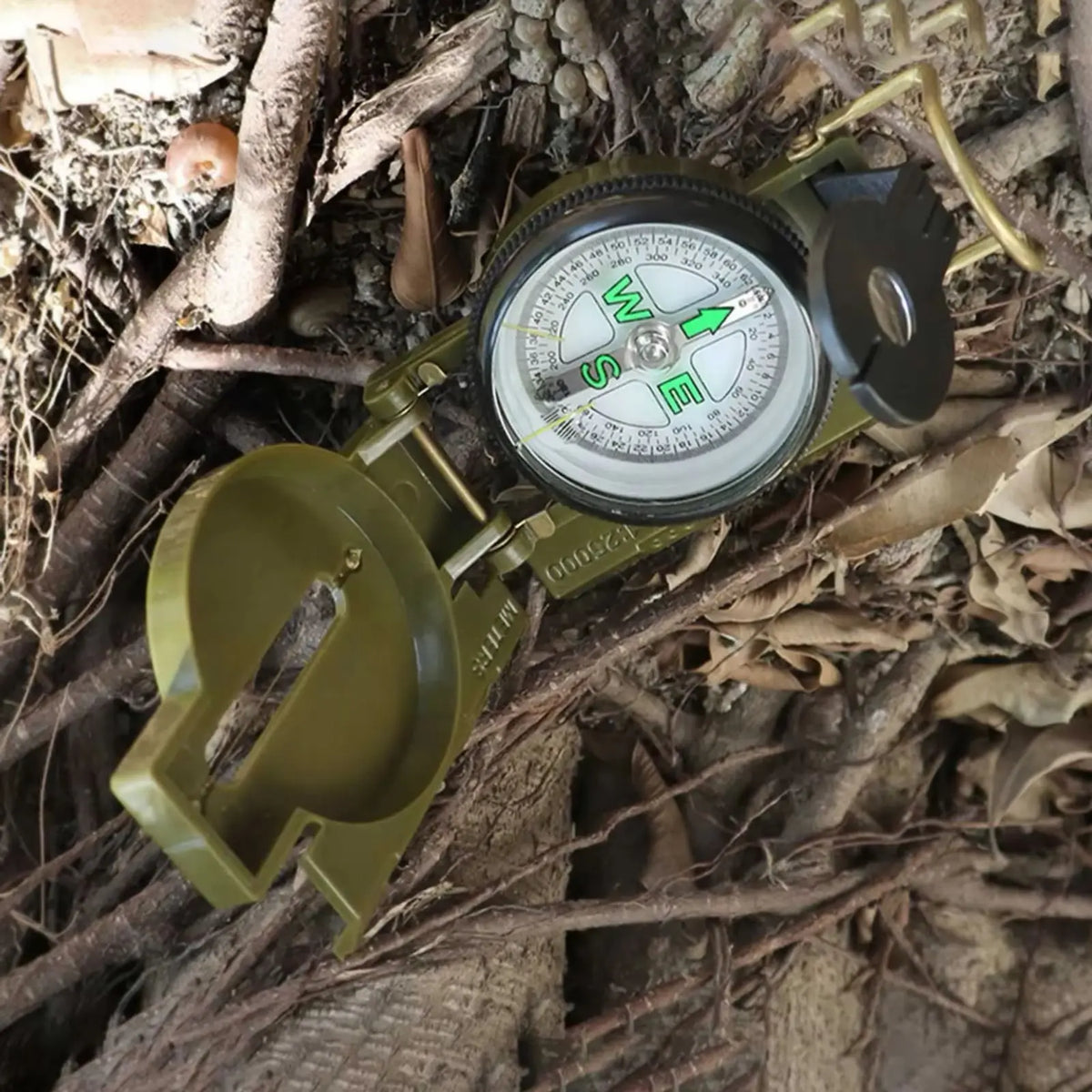 Lensatic field compass with phosphorescent markings for hiking and camping