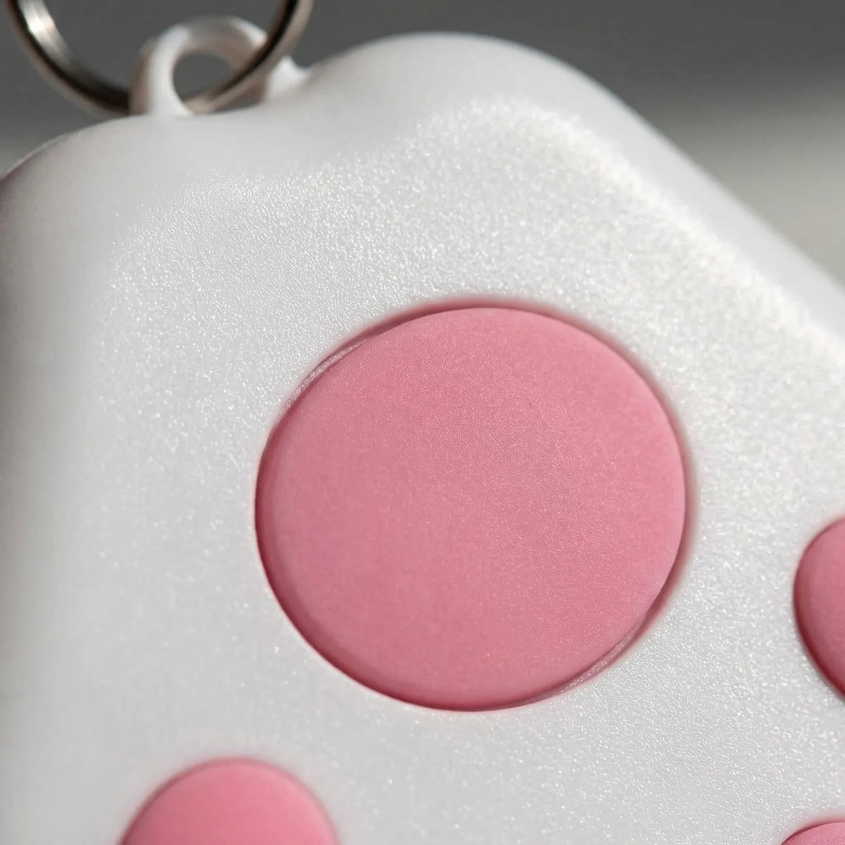 Paw-shaped Bluetooth tracker for pets and keys with proximity alert