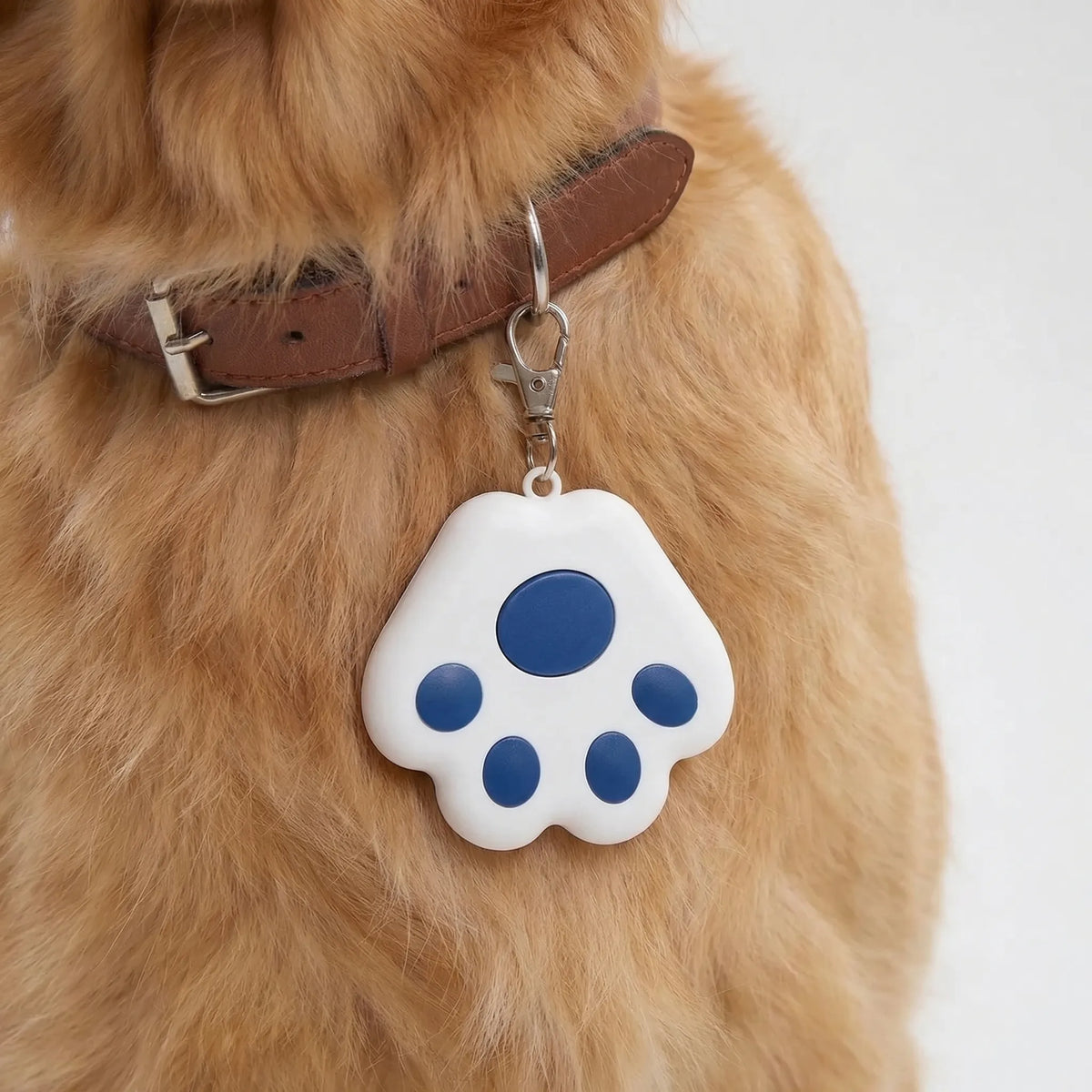 Paw-shaped Bluetooth tracker for pets and keys with proximity alert