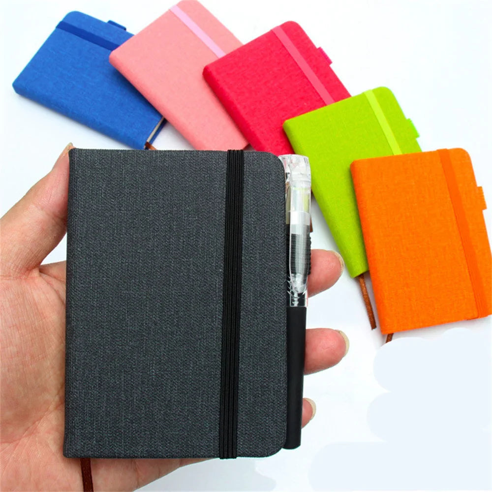 A7 portable coil notebook with blank pages and elastic closure
