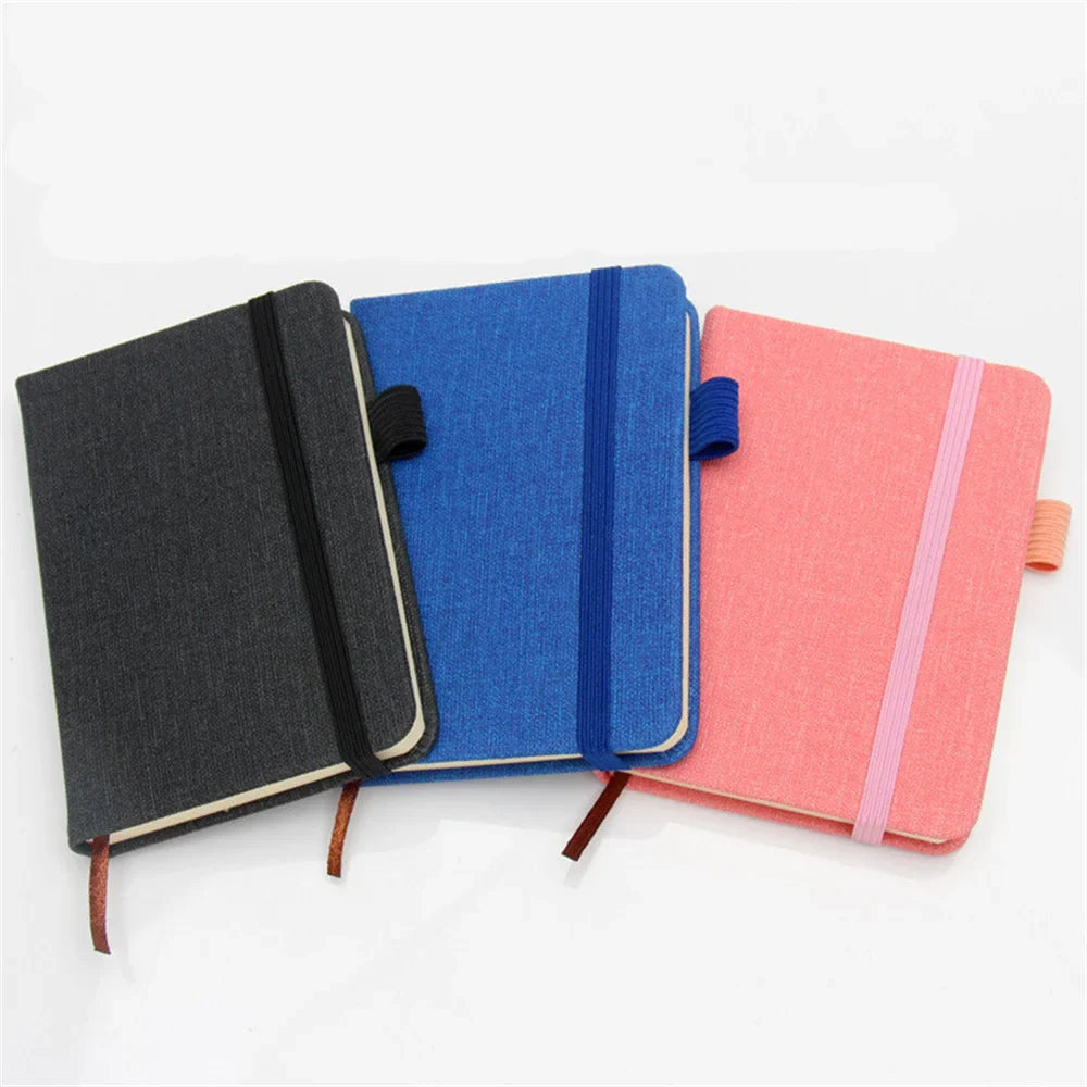 A7 portable coil notebook with blank pages and elastic closure