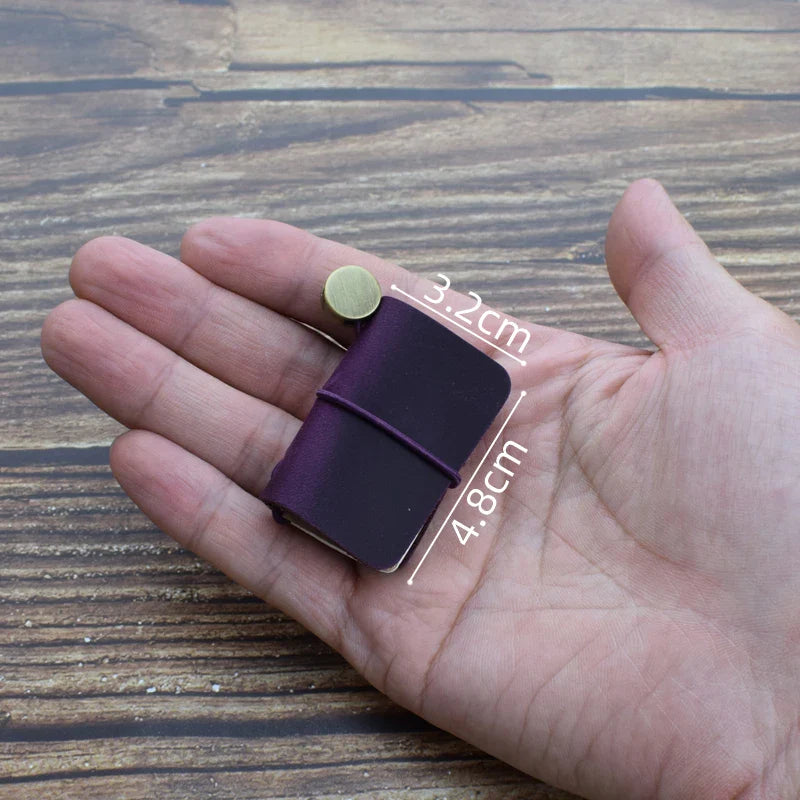 Mini pocket notebook with vintage-inspired design and secure wraparound closure