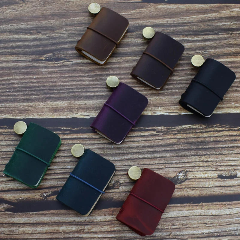 Mini pocket notebook with vintage-inspired design and secure wraparound closure