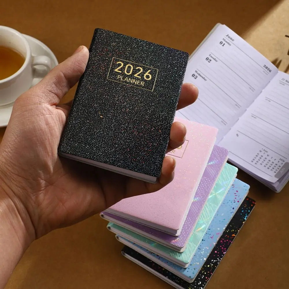 Compact pocket weekly planner with dated pages and mini calendars