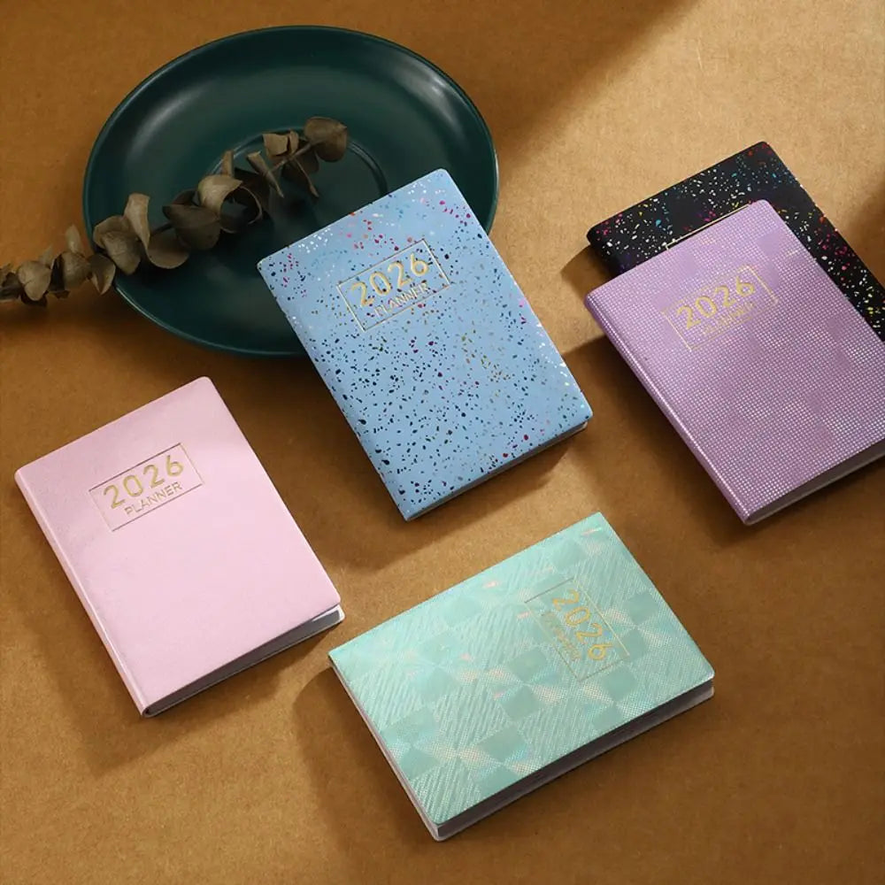 Compact pocket weekly planner with dated pages and mini calendars