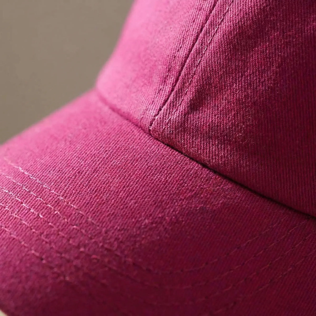 Women's ponytail baseball cap with open rear design and adjustable snapback
