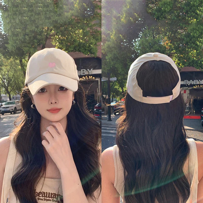 Women's ponytail baseball cap with open rear design and adjustable snapback