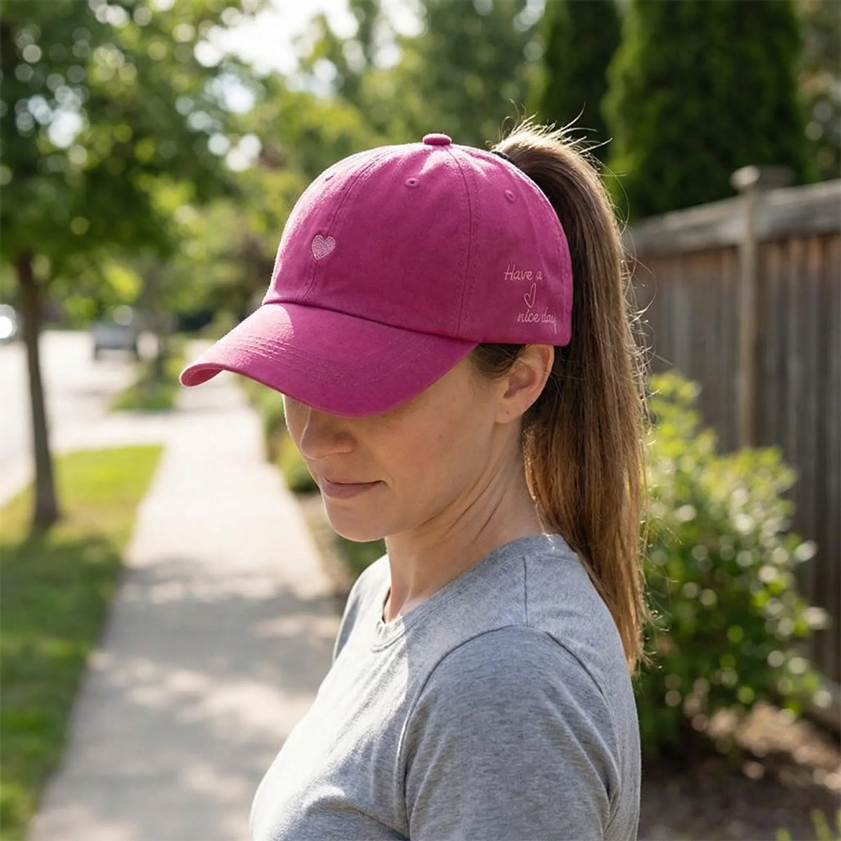 Women's ponytail baseball cap with open rear design and adjustable snapback