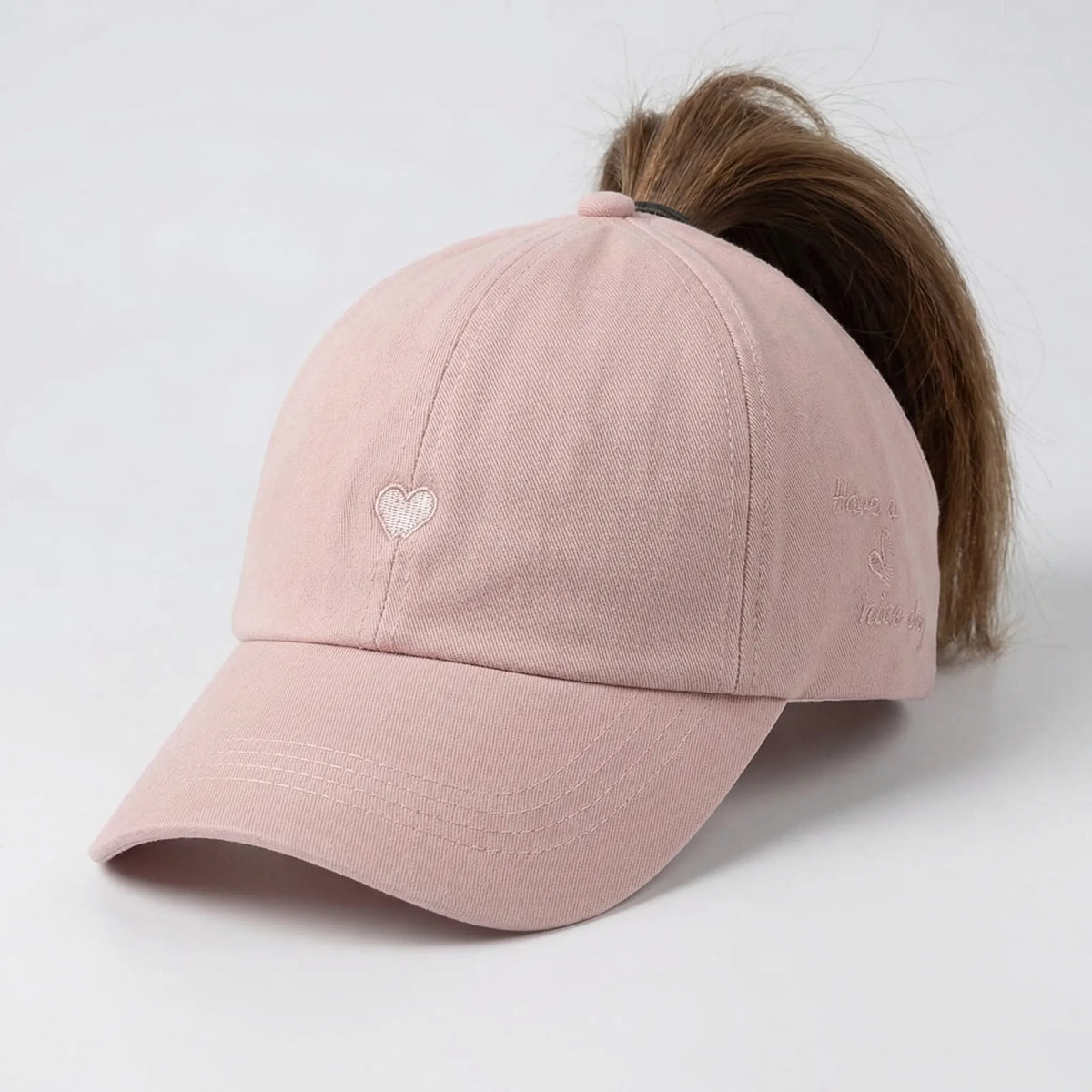 Women's ponytail baseball cap with open rear design and adjustable snapback