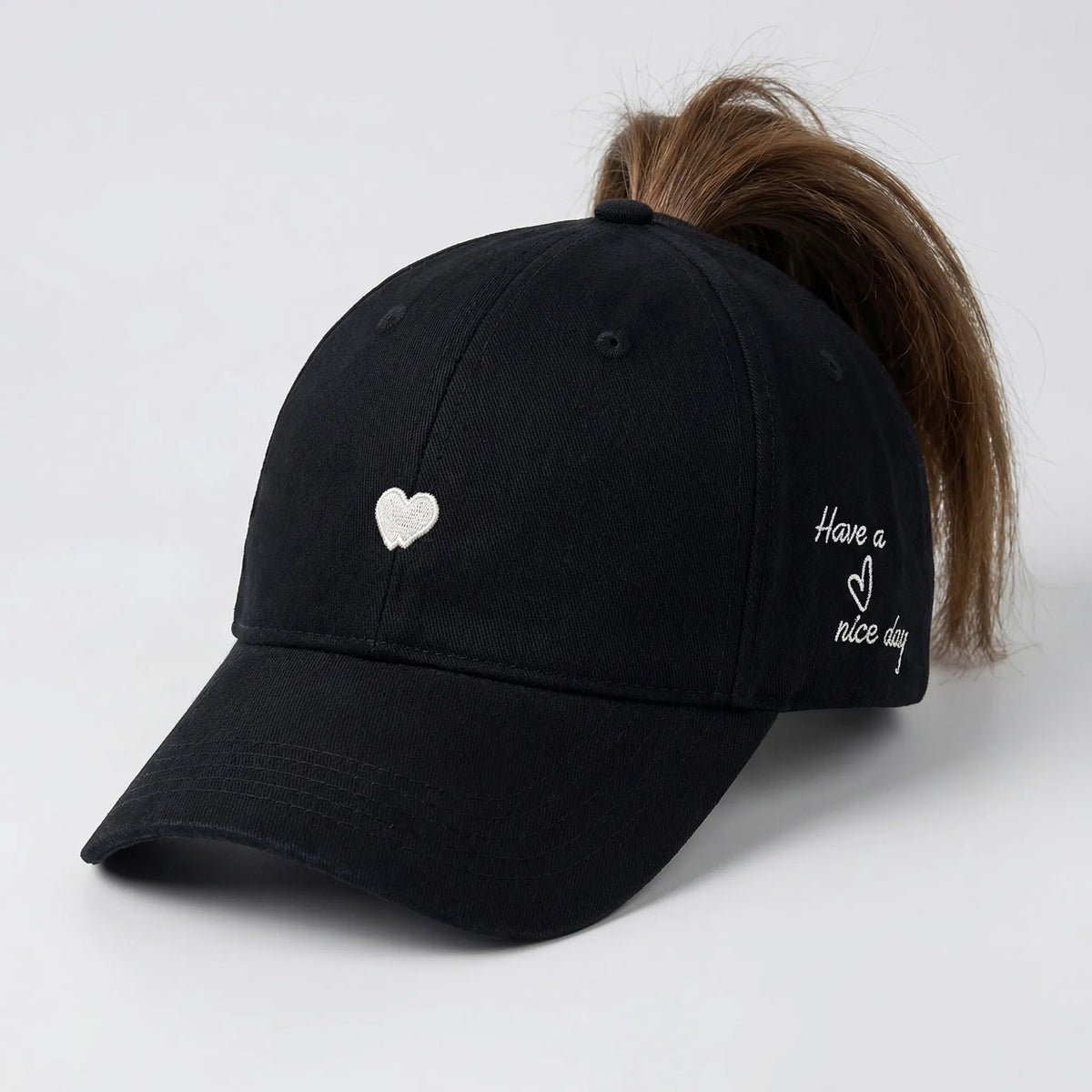 Women's ponytail baseball cap with open rear design and adjustable snapback