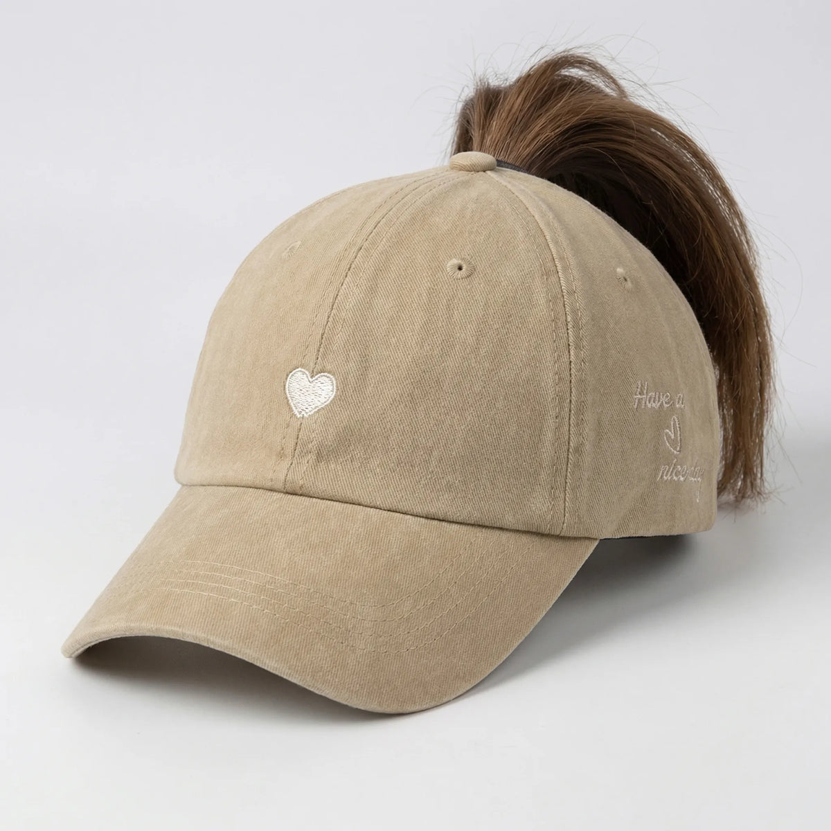 Women's ponytail baseball cap with open rear design and adjustable snapback