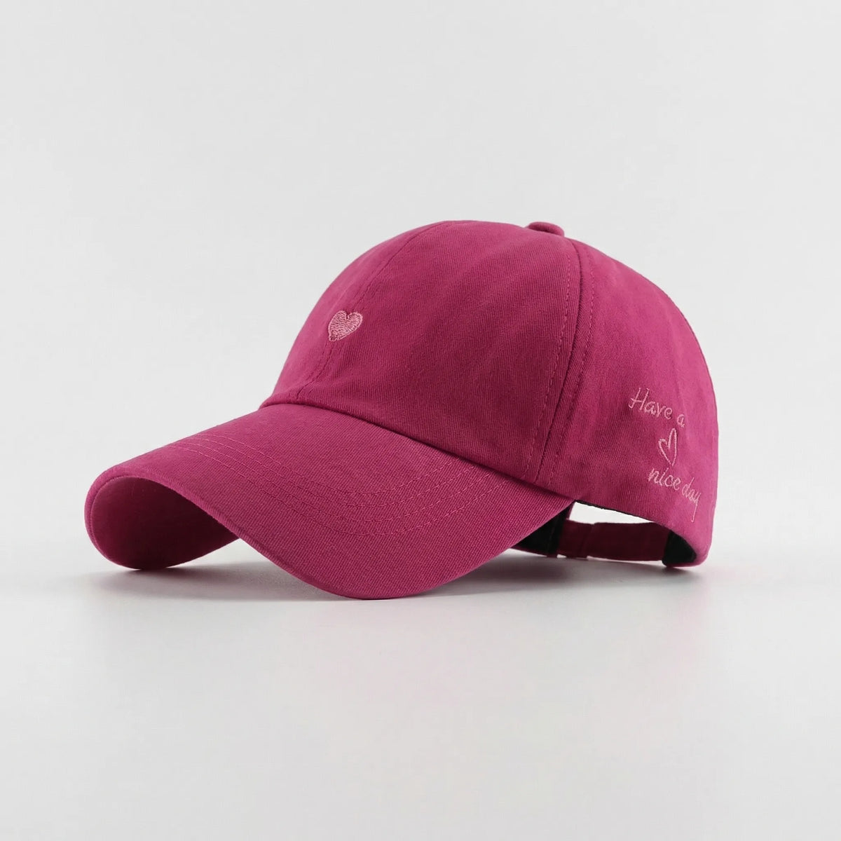 Women's ponytail baseball cap with open rear design and adjustable snapback