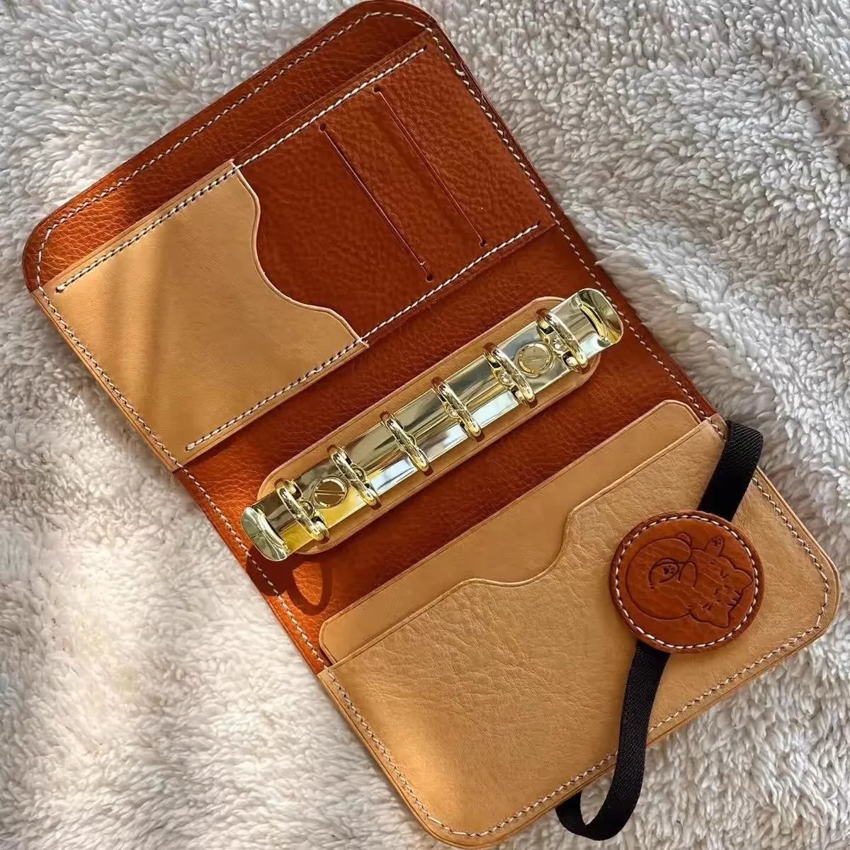Compact A7 portable planner with detachable loose leaf pages and elastic closure