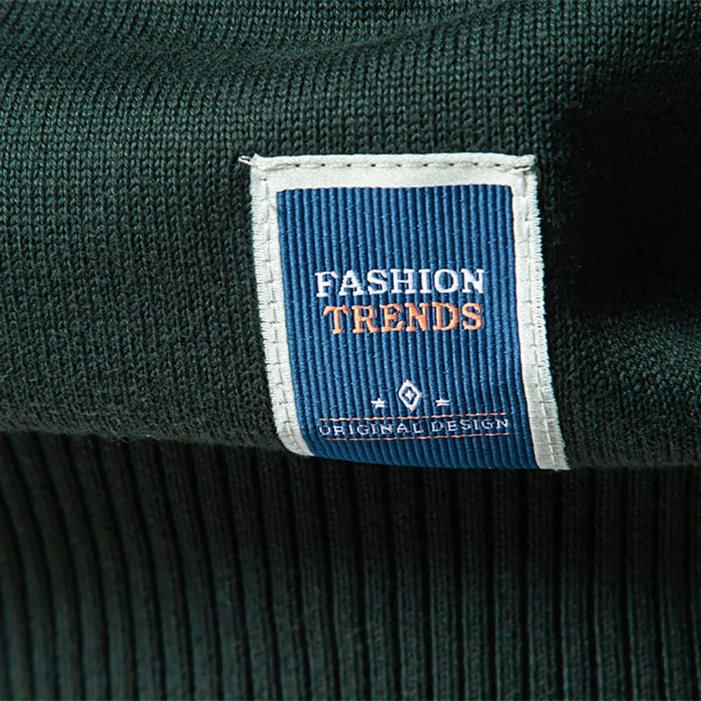 Quarter-zip pullover with stand collar and ribbed cuffs