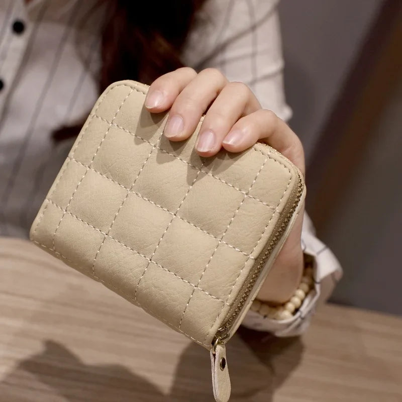 Compact quilted zip wallet with multiple card slots and coin pocket