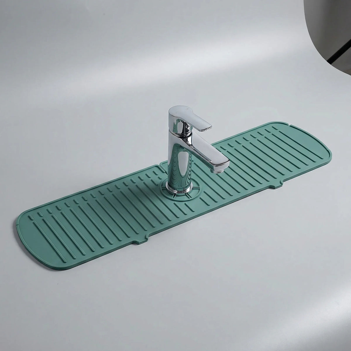 Flexible tap splash mat with drainage channels and centred cutout
