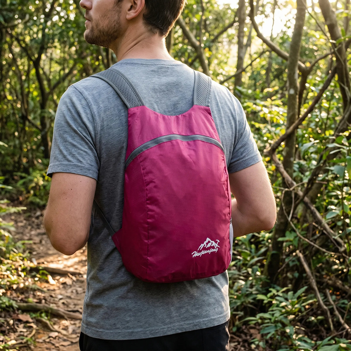 Foldable lightweight day pack with water-repellent material and ventilated mesh straps